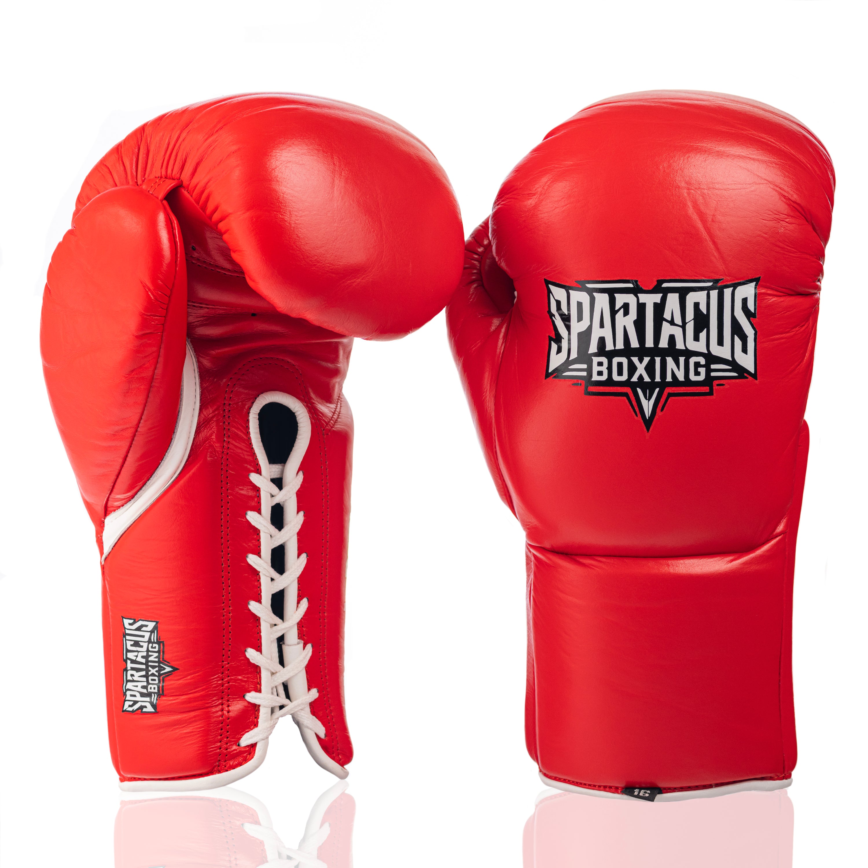 A pair of red boxing gloves with white laces and white trim, featuring the 'SPARTACUS BOXING' logo on the front glove, set against a clean white background with a subtle reflection.